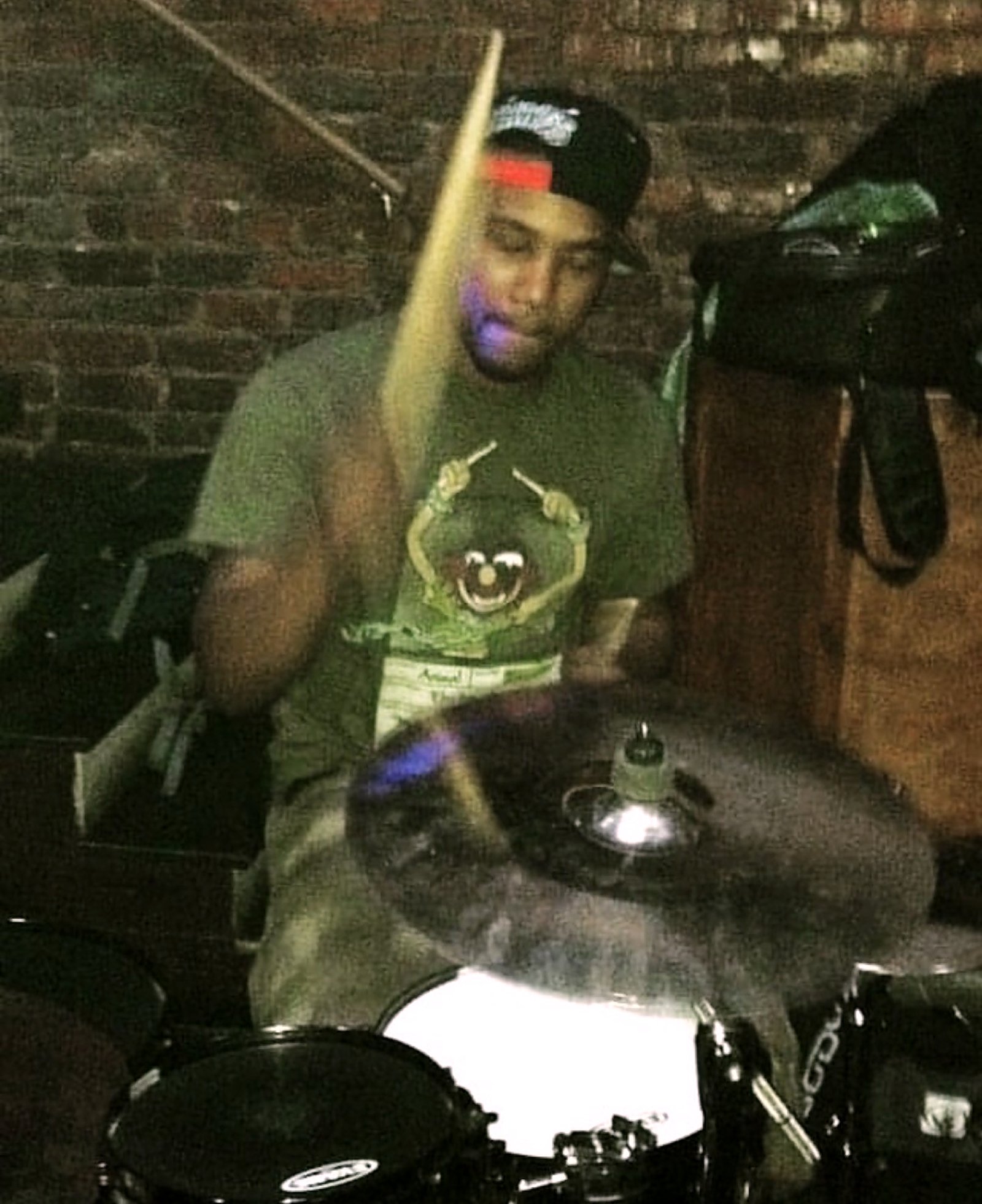 Archival photo — Dante Harris at the drum kit