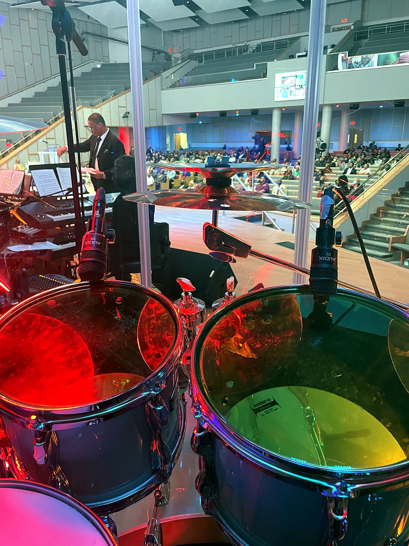 Dante Harris playing drums on a large stage